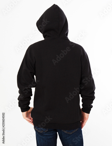 man in a black sweatshirt with a hood on his head is isolated on a white background - back view, top view