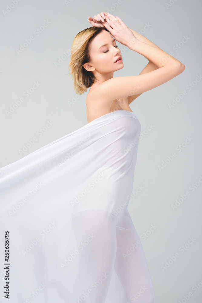 tender naked girl posing in elegant white veil, isolated on grey tender naked girl posing in elegant white veil, isolated on grey