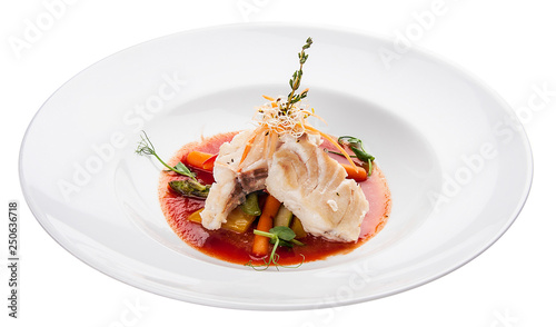 Smoked mackerel with vegetables and sauce. On white background