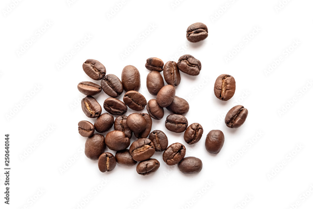 Roasted coffee beans isolated on white background. Close-up. Roasted coffee beans isolated on white background. Close-up.