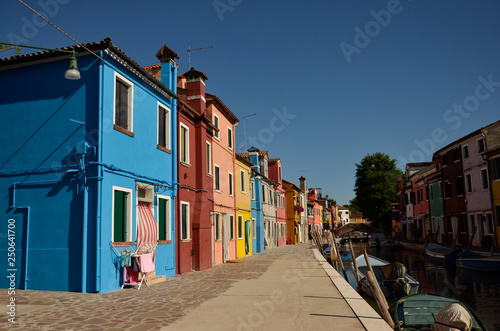 Colorful concept. Venice, Burano island canal, small colored houses and the boats © Marharyta