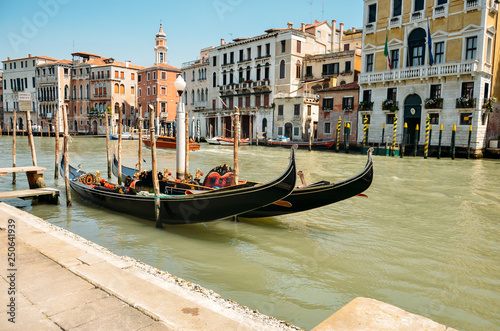 Gondolas in Venice. Gondolas on Grand canal. Gondola service tourist people travel around Venice in Italy © Marharyta