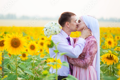 Islamic wedding ceremony in field. Wedding couple. Muslim marriage photo