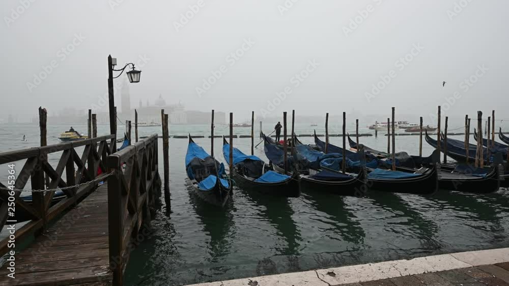 Venice, Italy - Palaces and Gondolas of the San Marco Basin wrapped in fog Venice, Italy - Palaces and Gondolas of the San Marco Basin wrapped in fog