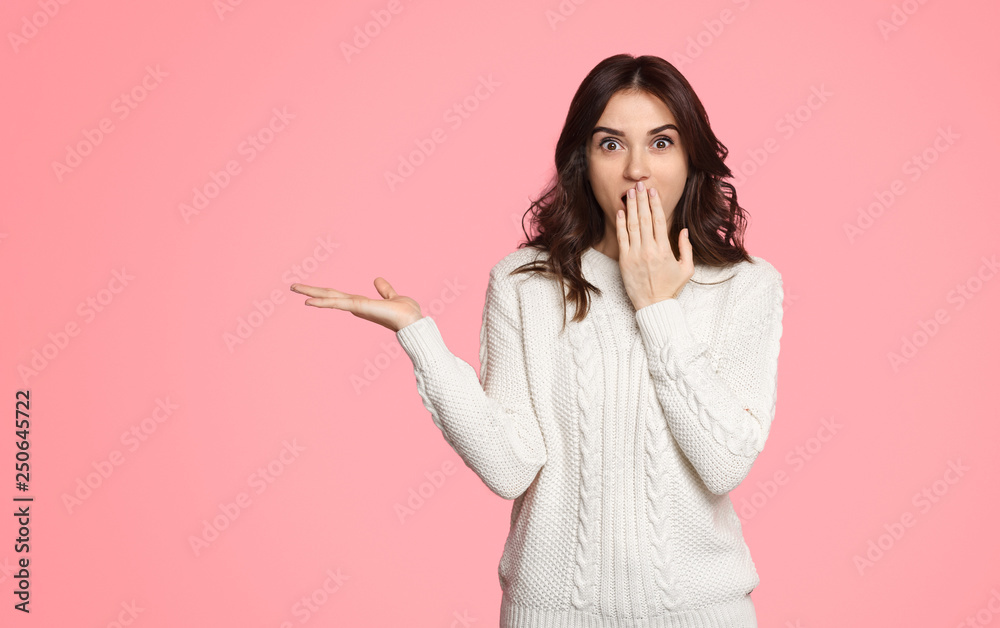 Shocked woman advertising empty space Shocked woman advertising empty space