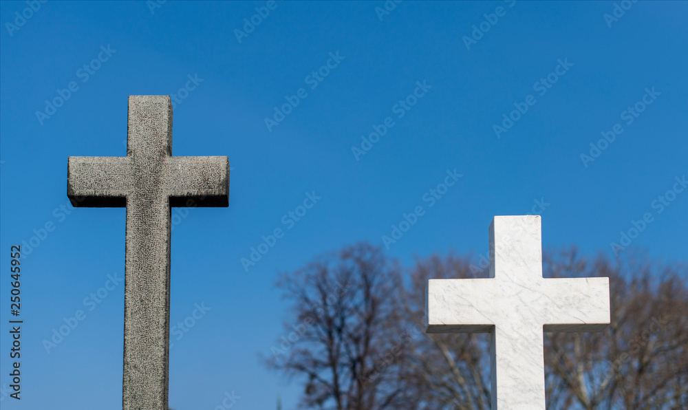 Graves with crosses at cemetery Graves with crosses at cemetery