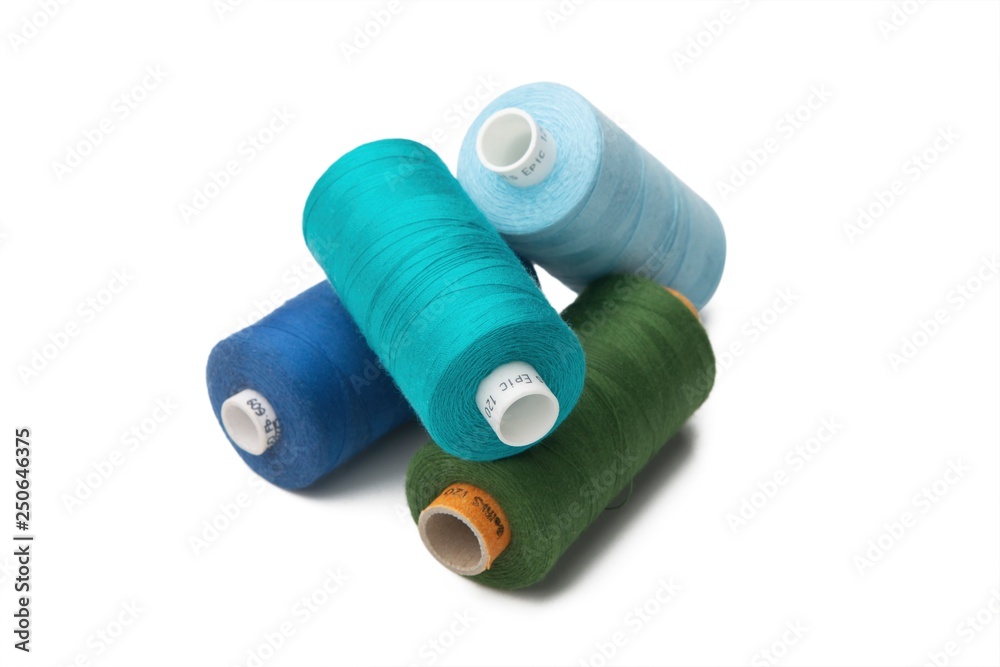 Rainbow colored sewing thread lined in a row Rainbow colored sewing thread lined in a row