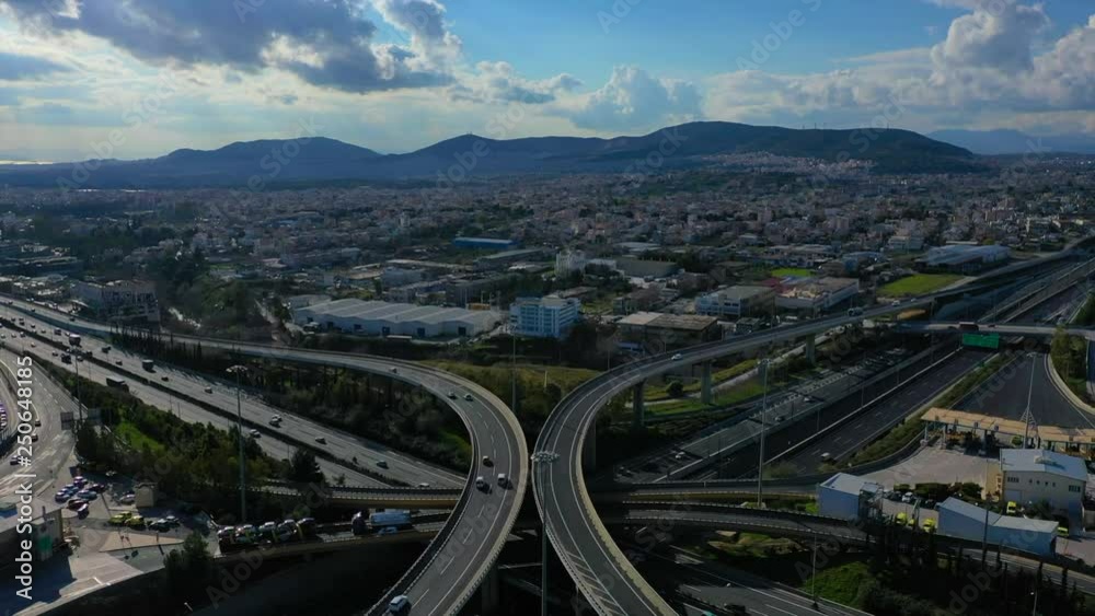 Aerial drone video of urban elevated toll road junction and interchange overpass in National road and Attiki odos of Attica, Athens, Greece Aerial drone video of urban elevated toll road junction and interchange overpass in National road and Attiki odos of Attica, Athens, Greece