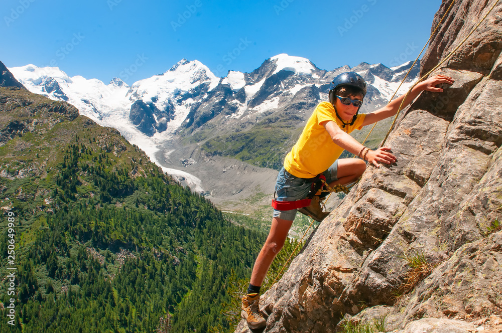 Obraz premium Girl during a climbing course in the high mountains