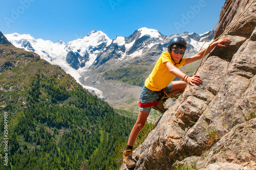Girl during a climbing course in the high mountains