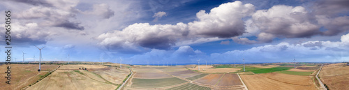 Industrial windmills aerial view in summer season.