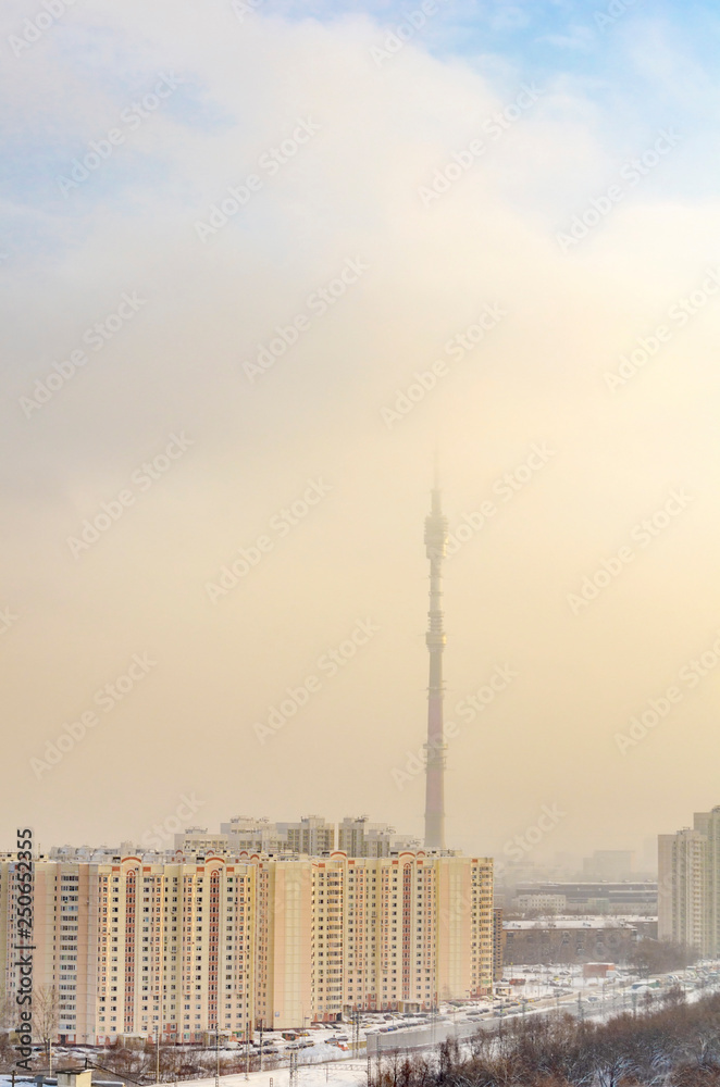 TV tower in fog in winter