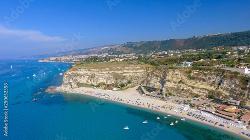 Fototapeta Naklejka Na Ścianę i Meble -  Road, coastline and houses of Calabria, beautiful aerial view in summer season