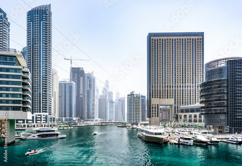 View of Dubai Marina - an cityscape with a blue bay, yachts and skyscrapers, Dubai, UAE, Jun.2018