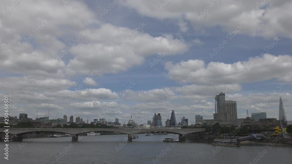 An overlook of London’s riverside with dramatic clouds passing over. An overlook of London’s riverside with dramatic clouds passing over.