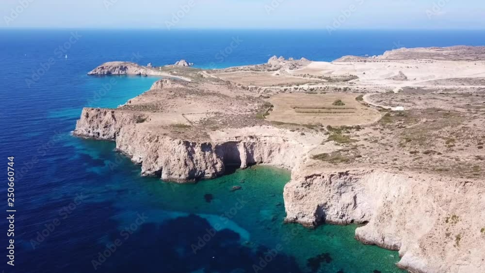 Aerial drone bird's eye view video of volcanic and exotic rocky beach with turquoise and sapphire clear waters of Plathiena in island of Milos, Cyclades, Greece Aerial drone bird's eye view video of volcanic and exotic rocky beach with turquoise and sapphire clear waters of Plathiena in island of Milos, Cyclades, Greece