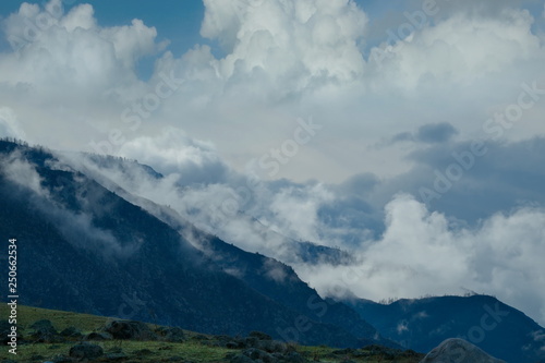 Russia. The South Of Western Siberia. mountain Altai. Fog in the mountains along the Chui tract.