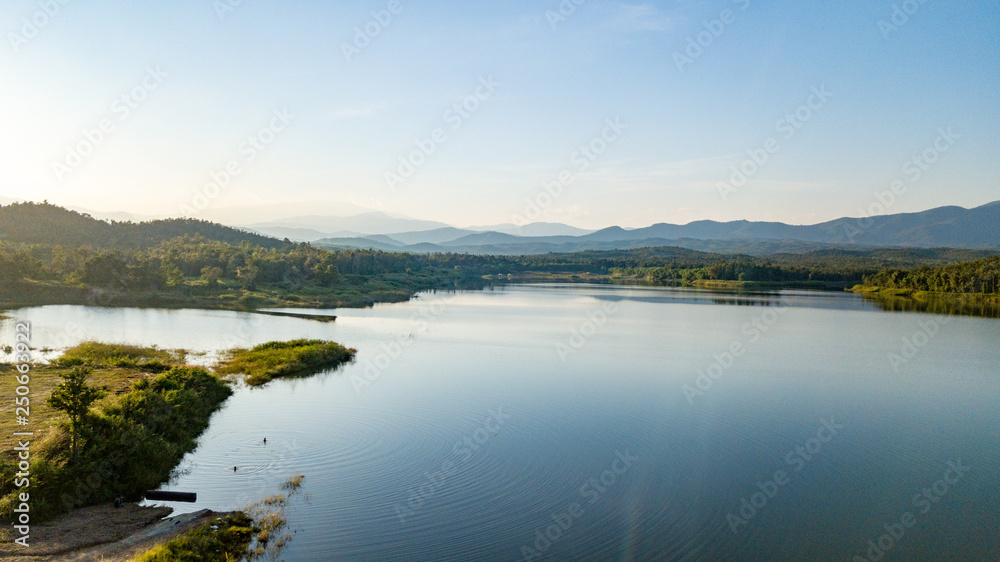 Pong Chor Reservoir in Mae Wang National Park Chiang Mai, Thailand. Photo in aerial view by drone with beautiful nature.  Abstract of peaceful, peace wallpaper background.