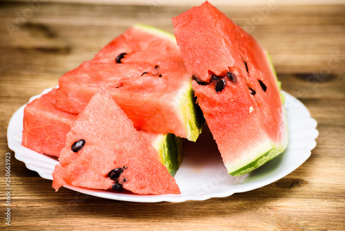 Watermelon cut into pieces on a plate