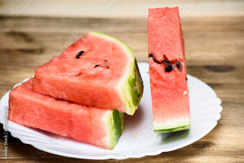 Watermelon cut into pieces on a plate