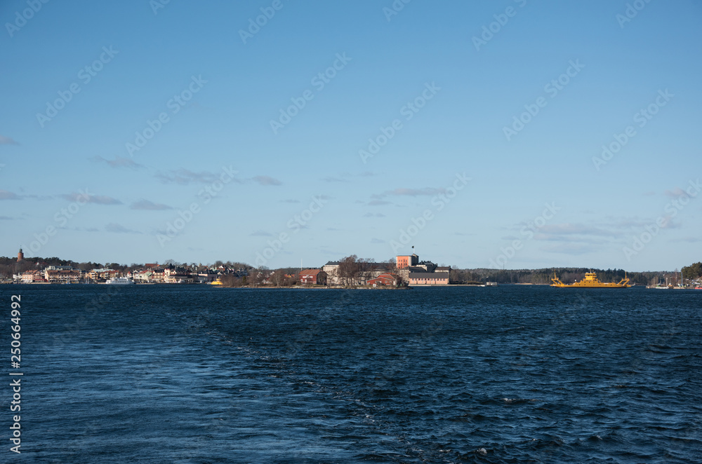 Houses, boats, ferrys and fortress island in Vaxholm and Stockholm archipelago