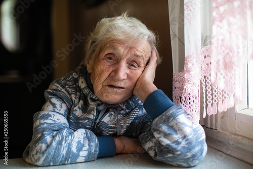 Portrait of a melancholy elderly woman.
