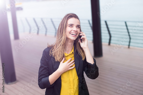 Young businesswman using mo...