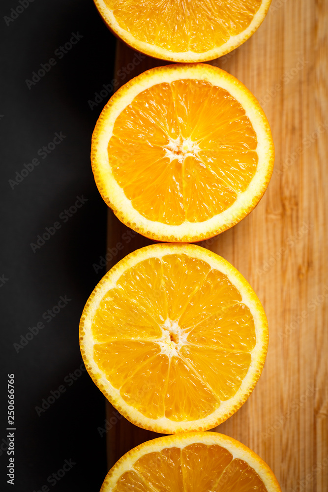 cut orange on wooden background cut orange on wooden background