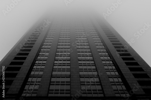 Skyscraper leading into fog and mist