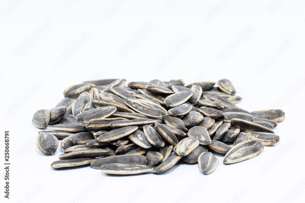 pile of sunflower seeds isolated on white background