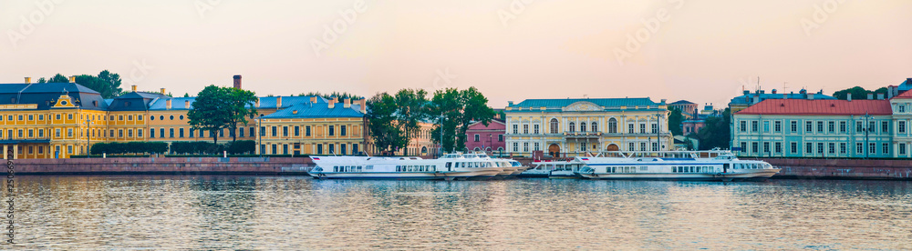 Panoramic view from the bank of the Neva river, St. Petersburg, Russia. View of Vasilyevsky Island on a summer morning.