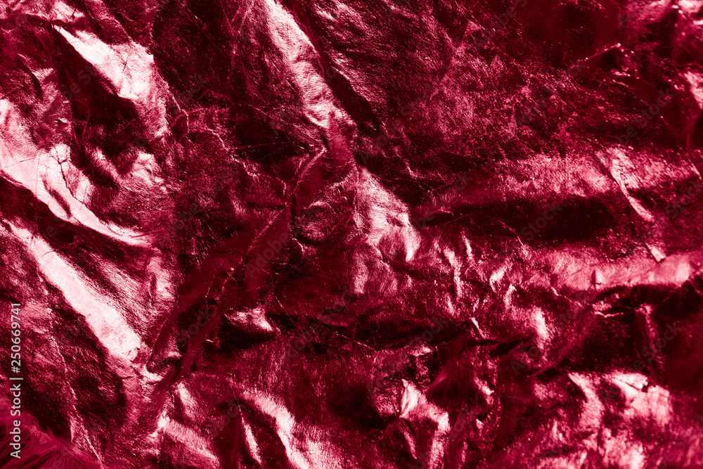 Red crumpled reflective background, grunge style. Red crumpled reflective background, grunge style.