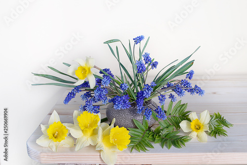 Bouquet of spring flowers of daffodils and hyacinths on white background