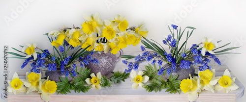 Bouquet of spring flowers of daffodils and hyacinths on white background