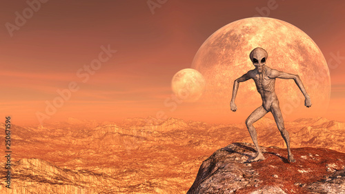 Φωτογραφία Illustration of a gray alien in a combative comical pose atop a mountain peak with moons in the background on a red world