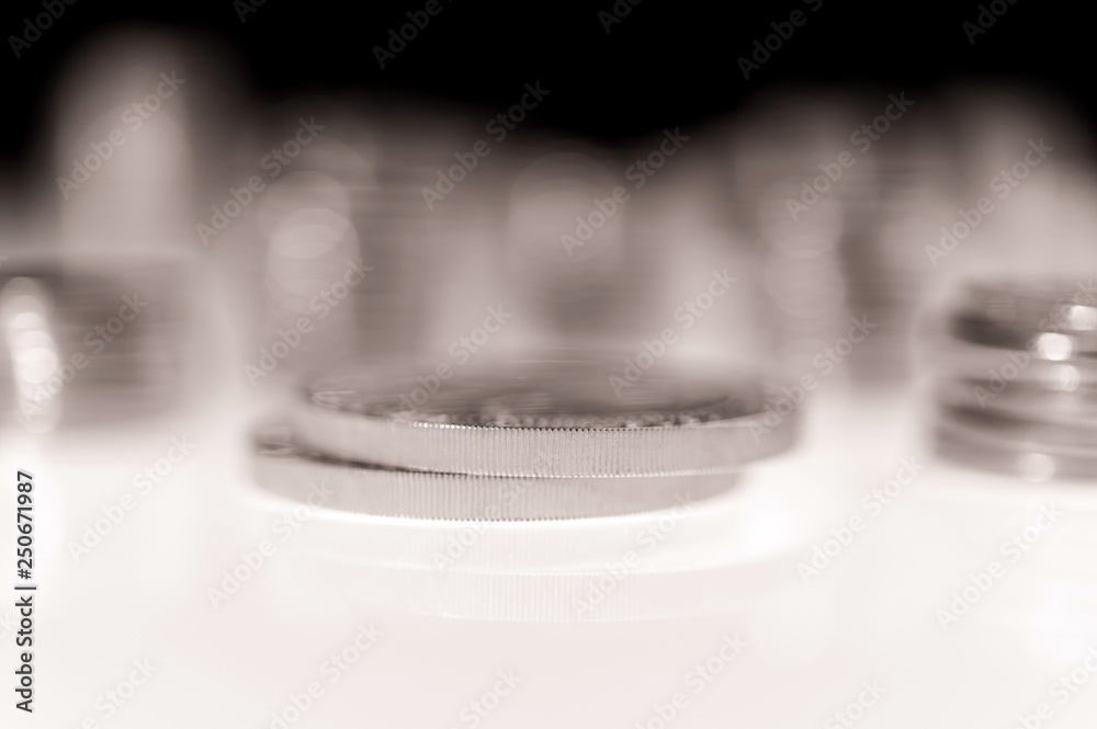 Stack of silver coins macro. Rows of coins for finance and banking concept. Trade in precious metals Stack of silver coins macro. Rows of coins for finance and banking concept. Trade in precious metals