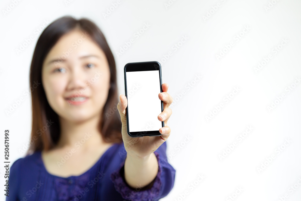 Asian women in relax act showing her smartphone with white screen close up.