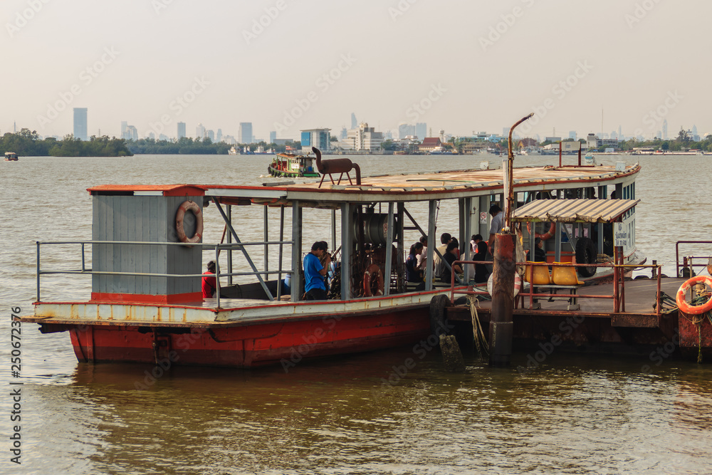 Samut Prakan, Thailand - March 25, 2017: Local ferry pier across Chao Phraya River at Amphur Muang district, Samut Prakarn, Thailand. Samut Prakan, Thailand - March 25, 2017: Local ferry pier across Chao Phraya River at Amphur Muang district, Samut Prakarn, Thailand.