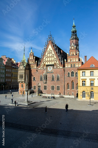 City hall with tower on main Wroclaw square, touristic season, sunny and blue sky