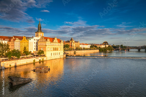 Vltava river and waterfront of the old town with the theater in Prague at sunset  Czech Republic  Europe.