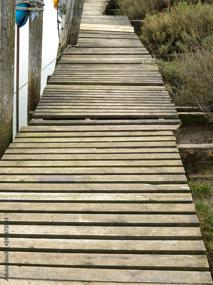Uneven wooden boardwalk jetty Uneven wooden boardwalk jetty