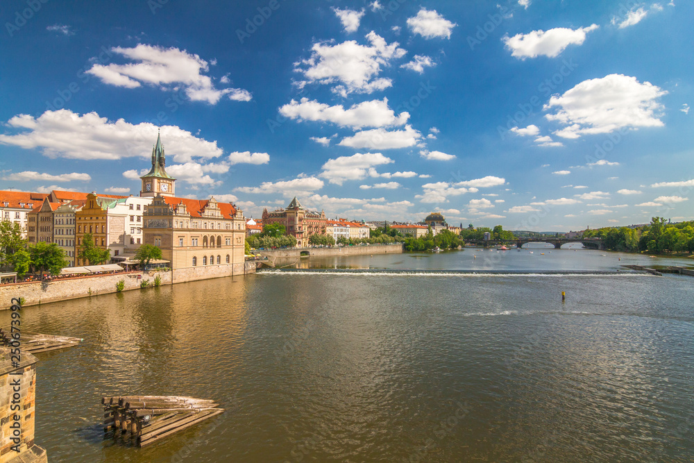 Vltava river and waterfront of the old town with the theater in Prague, Czech Republic, Europe.