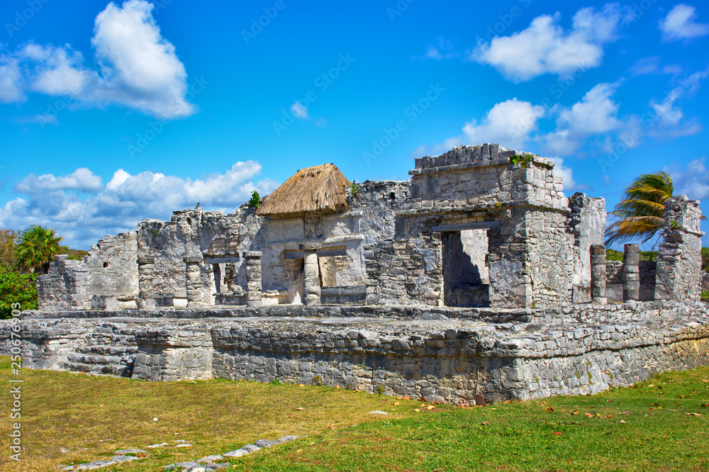 Mayan ruins and a beautiful day, blue sky with some white clouds. Caribbean coast in Tulum