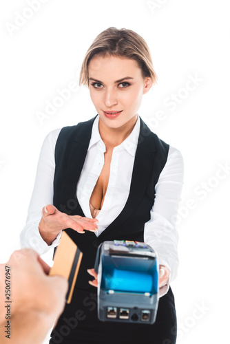 waitress in black uniform holding terminal wile man giving credit card isolated on white