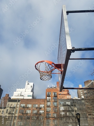 basketball hoop and net against blue sky