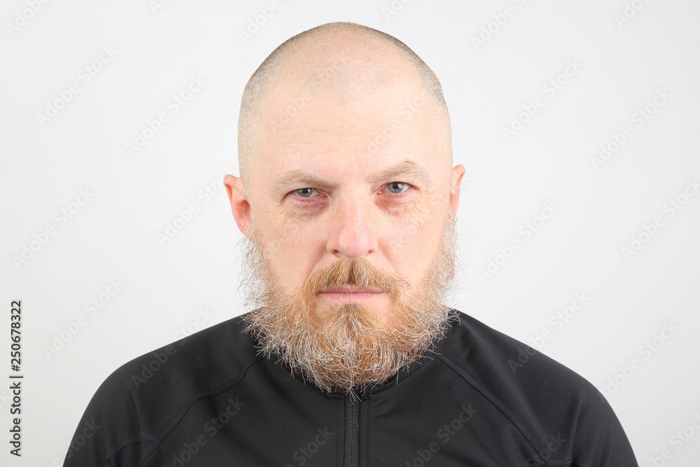 portrait of a bearded man on a light background portrait of a bearded man on a light background
