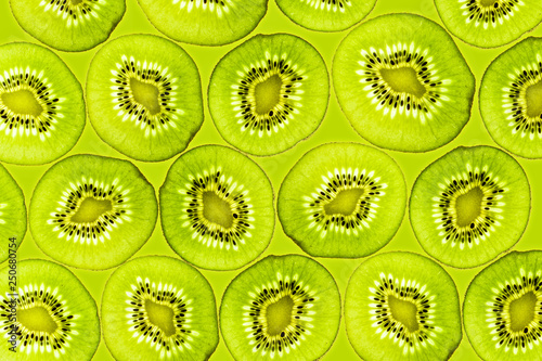 Kiwi slices illuminated from below Background Fruits Top view