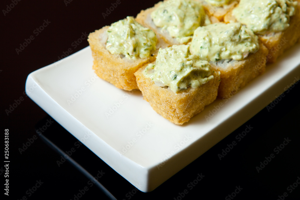 Hot fried Sushi Roll with with vegetables. Set sushi menu. Hot fried Sushi Roll with with vegetables. Set sushi menu.