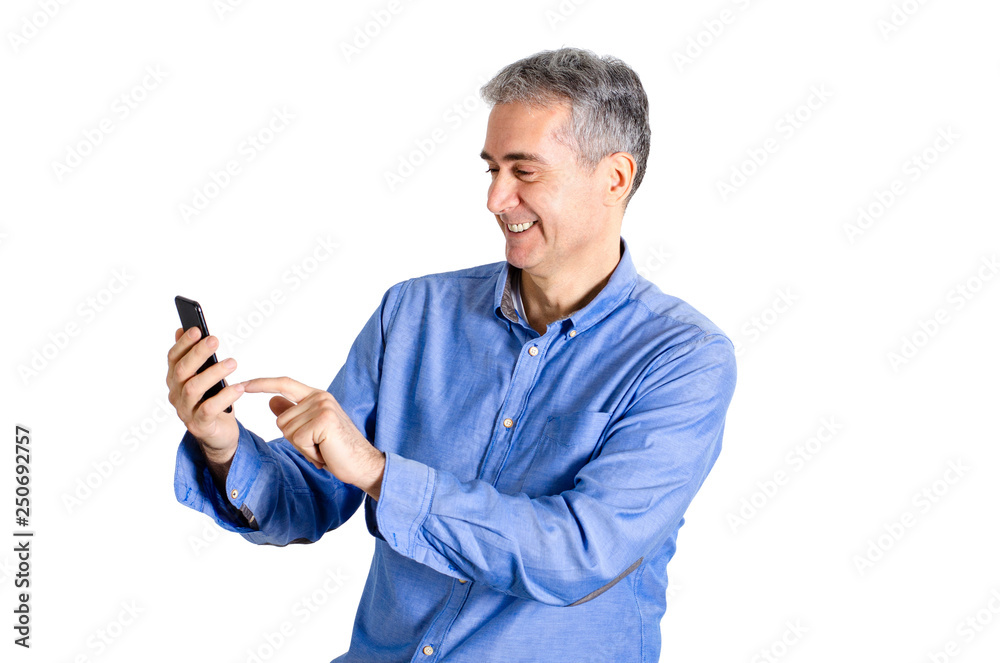 Smiling senior man touching the screen of cell phone Smiling senior man touching the screen of cell phone