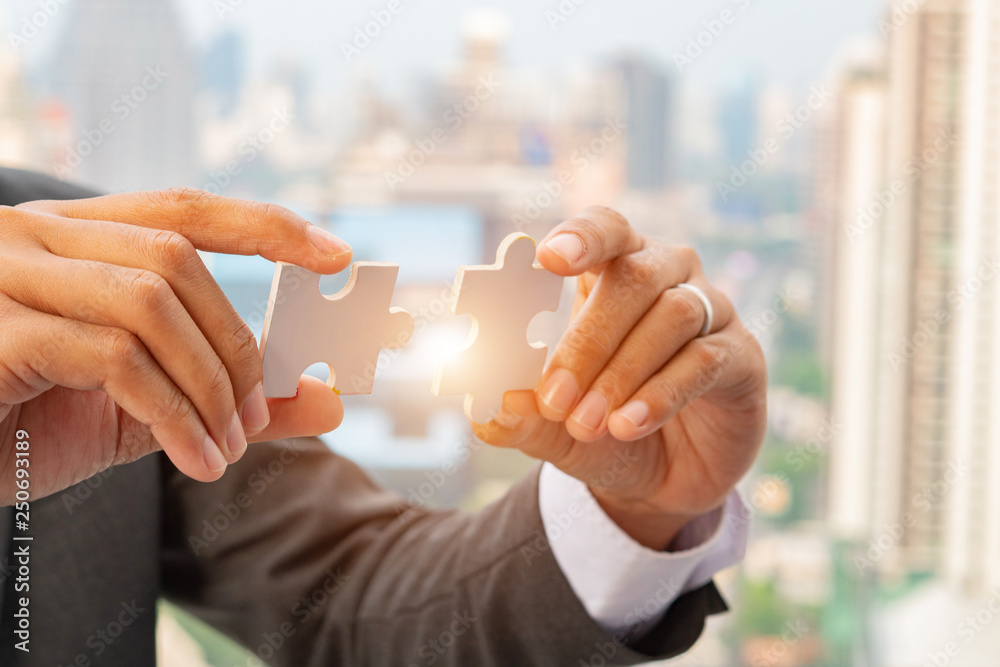 custom made wallpaper toronto digitalBusiness solutions, success and strategy concept. Businessman hand connecting jigsaw puzzle.